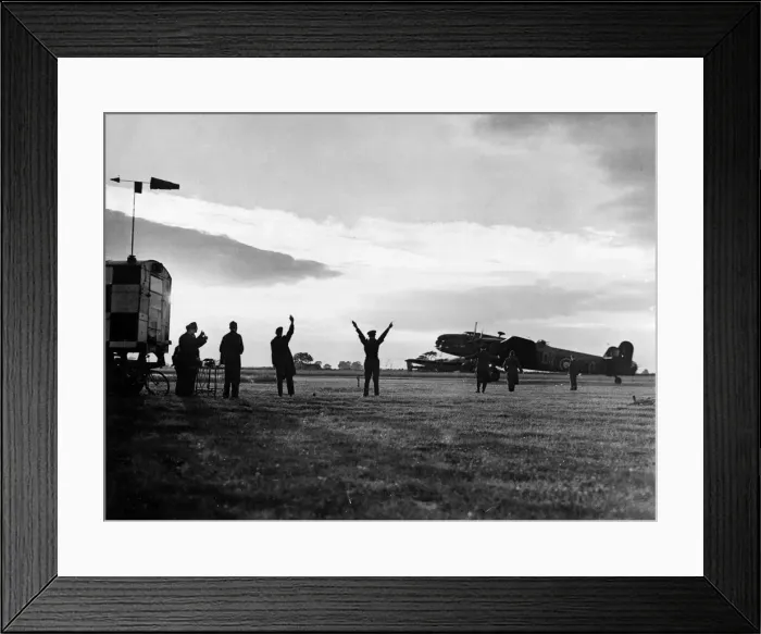 Framed Print : The group captain commanding officer of an RAF station signals a Halifax bomber to begin