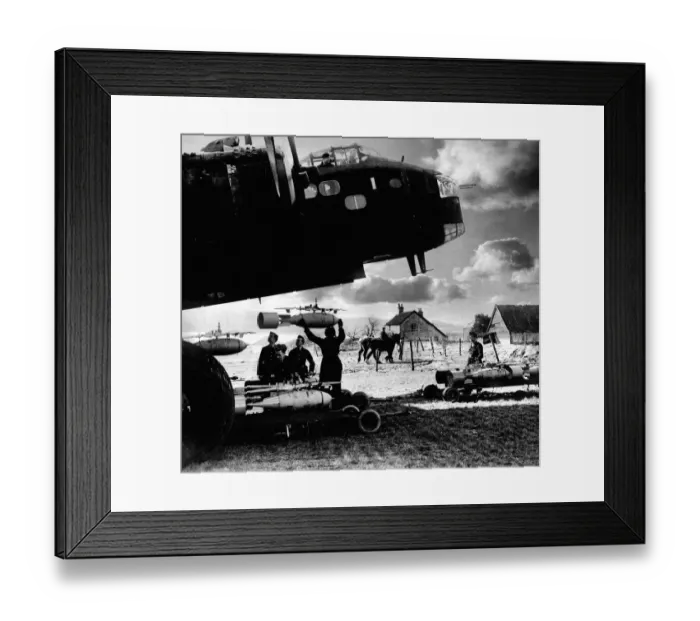 Framed Print : RAF ground crew loading bombs onto a Stirling bomber before a raid during World War Two Framed Print : RAF ground crew loading bombs onto a Stirling bomber before a raid during World War Two