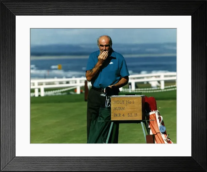 Framed Print : Sean Connery at first hole St Andrews golf course hand on moustache golf bag clubs