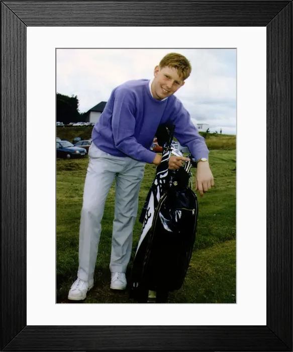 Framed Print : Stephen Gallacher on golf course holding golf bag containing clubs Framed Print : Stephen Gallacher on golf course holding golf bag containing clubs