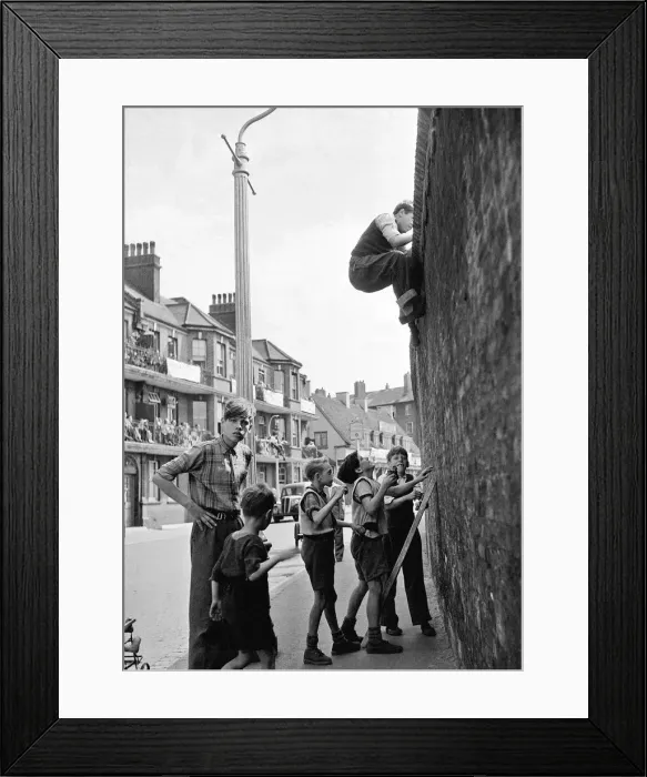 Framed Print : Cricket England v Australia at the Oval Young boys climb the wall at the oval
