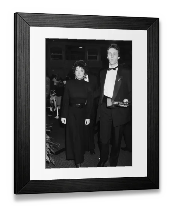 Framed Print : Pop singer Kate Bush arrives at an award ceremony in London with A mystery man