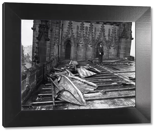 Unidentified gentleman seen here inspecting the damage to the roof of St Michael