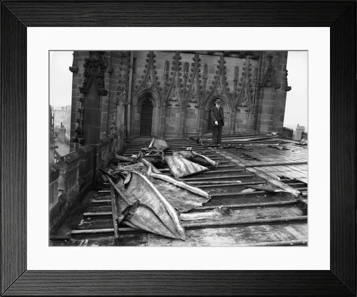 Framed Print : Unidentified gentleman seen here inspecting the damage to the roof of St Michael Framed Print : Unidentified gentleman seen here inspecting the damage to the roof of St Michael