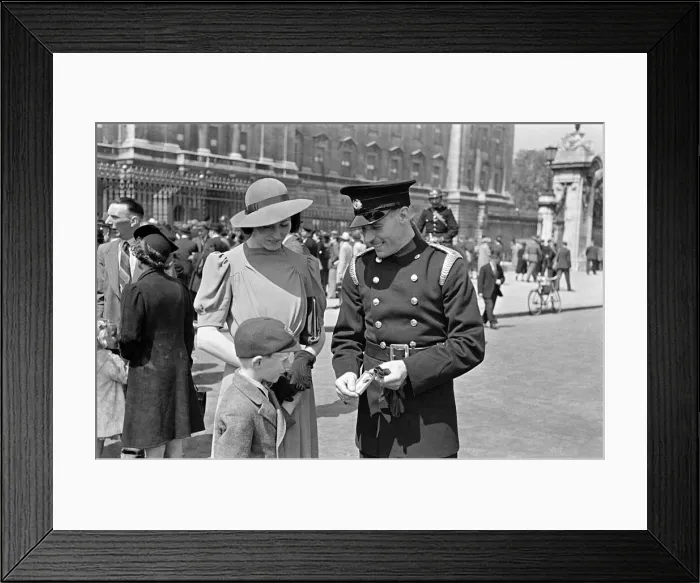 Framed Print : Temporary fireman Skillern receives George medal at the Palace, with his wife and child Framed Print : Temporary fireman Skillern receives George medal at the Palace, with his wife and child