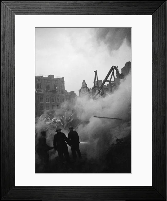 Framed Print : V2 damage at Middlesex St. Aldgate East. Firemen working on a Norwegian Naval training Framed Print : V2 damage at Middlesex St. Aldgate East. Firemen working on a Norwegian Naval training