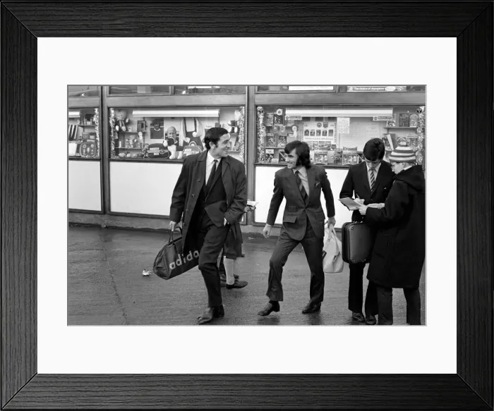Framed Print : George Best right as he left Old Trafford ground to board the coach on route to Ipswich