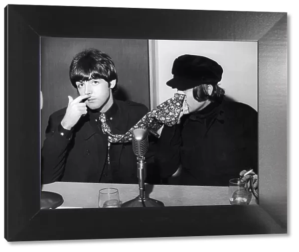 The Beatles Paul McCartney and John Lennon pictured at a backstage news press conference