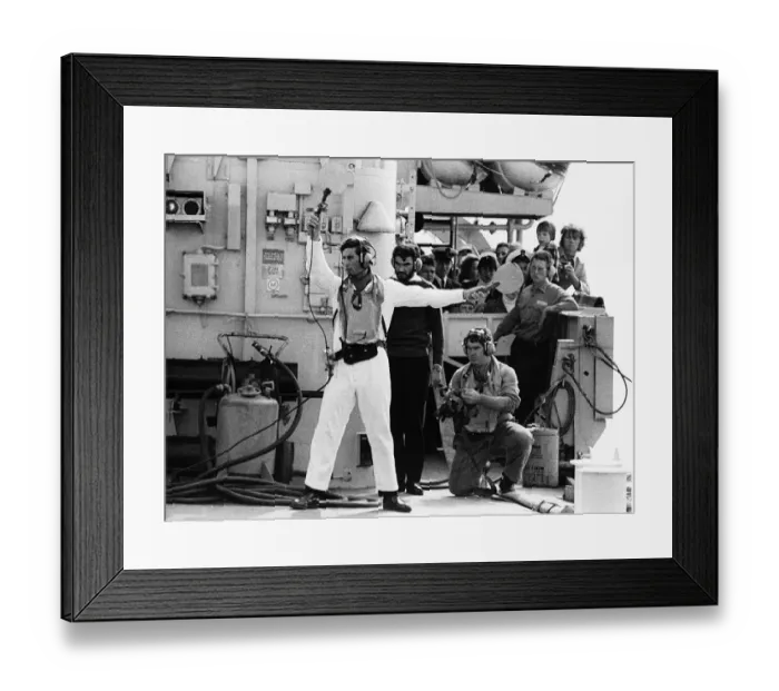Framed Print : Prince Charles acting as batman to guide the helicopter of HMS Jupiter flight deck Framed Print : Prince Charles acting as batman to guide the helicopter of HMS Jupiter flight deck