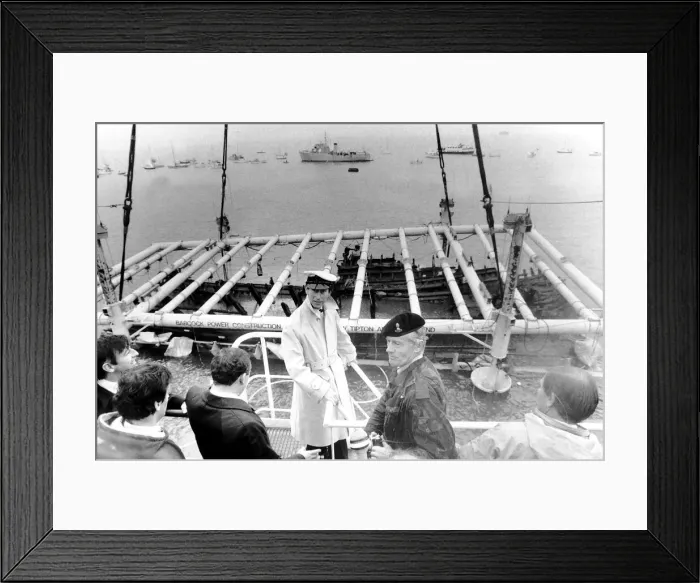 Framed Print : Prince Charles seen on the crane Tug Mor with the War Ship of Henry VIII as she breaks Framed Print : Prince Charles seen on the crane Tug Mor with the War Ship of Henry VIII as she breaks