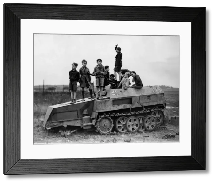 Framed Print : World War 2 1944 Children play on a knocked out German half track armoured vehicle Framed Print : World War 2 1944 Children play on a knocked out German half track armoured vehicle