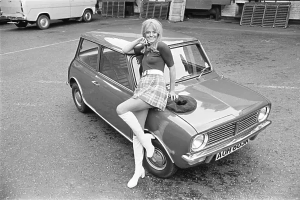 Reveille model seen here posing with a Mini Clubman car which is a top prize in
