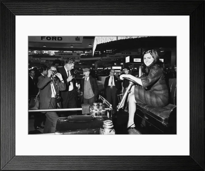 Framed Print : Models drapped over a vintage car at the British International Motor Show in London 19th Framed Print : Models drapped over a vintage car at the British International Motor Show in London 19th