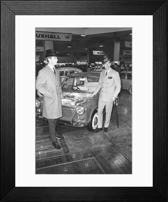 Framed Print : Male Models pose with Austin Mini cars at the British International Motor Show in London