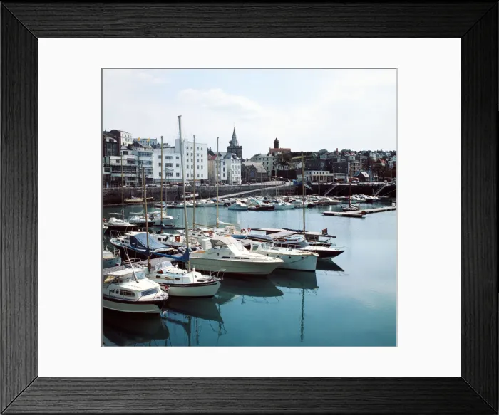 Framed Print : A view of St Peter port harbour on the island of Guernsey, Channel Islands Framed Print : A view of St Peter port harbour on the island of Guernsey, Channel Islands