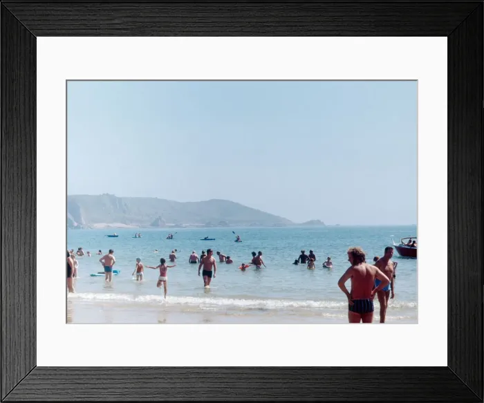 Framed Print : Holidaymakers and locals enjoy a day out on the beach on the Channel Island of Jersey Framed Print : Holidaymakers and locals enjoy a day out on the beach on the Channel Island of Jersey