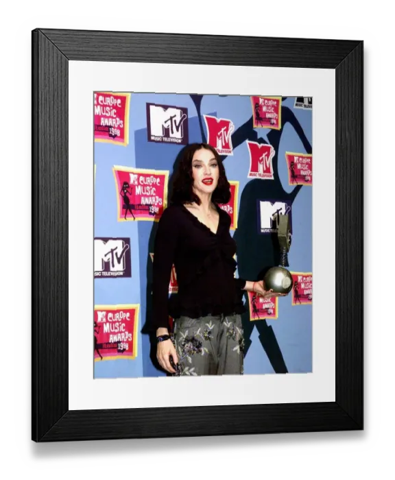 Framed Print : American pop star Madonna holding her award at the MTV Awards Ceremony in Milan