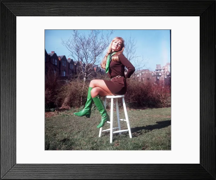 Framed Print : Stepanie Beecham Actress sitting on chair on grass