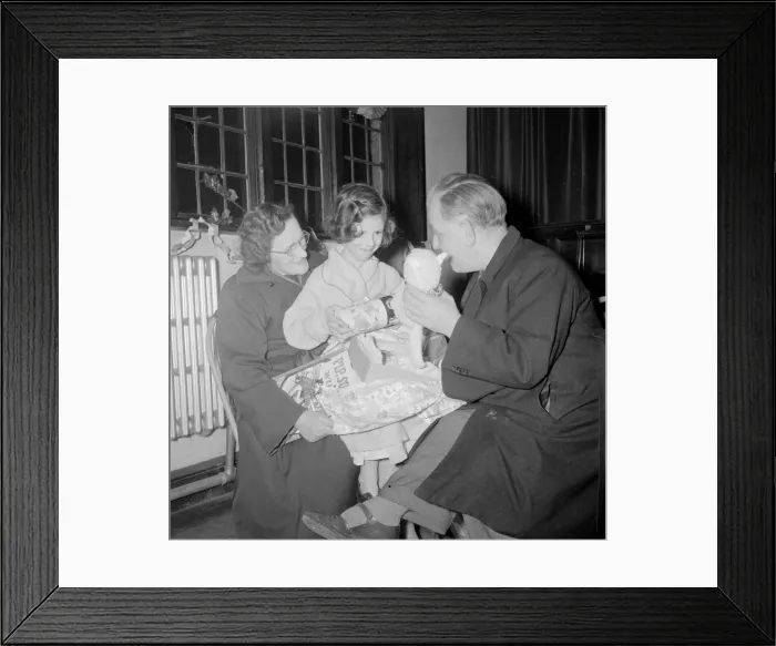 Framed Print : Mr and Mrs O Hara seen here giving present to one of the Children at the St Agnes Framed Print : Mr and Mrs O Hara seen here giving present to one of the Children at the St Agnes