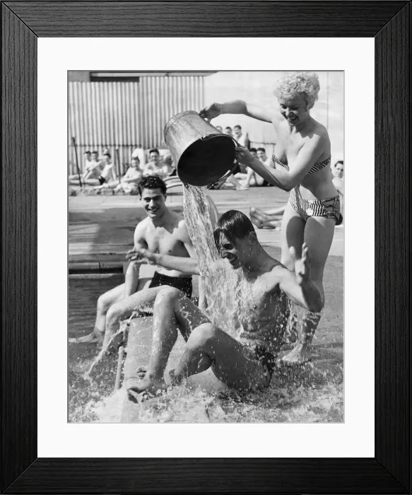 Framed Print : One way to cool off in the present heat wave is to have a bucket of cold water thrown Framed Print : One way to cool off in the present heat wave is to have a bucket of cold water thrown