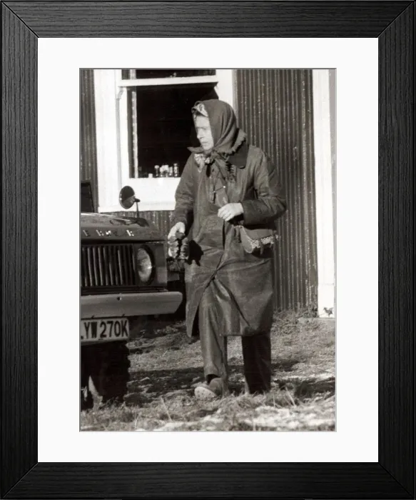 Framed Print : Queen Elizabeth II at Sandringham in Norfolk Outdoor clothing holding cloth