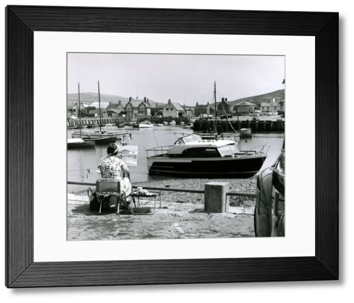 Framed Print : Painter painting seascapes and boat scenes at a seaside resort Circa 1960 Framed Print : Painter painting seascapes and boat scenes at a seaside resort Circa 1960