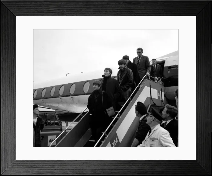 Framed Print : Pop Group The Beatles on the steps of their plane at London Airport Framed Print : Pop Group The Beatles on the steps of their plane at London Airport