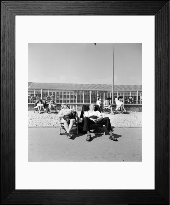 Framed Print : Butlins Holiday Camp at Bognor a couple sleeping in a deckchair with their dog Framed Print : Butlins Holiday Camp at Bognor a couple sleeping in a deckchair with their dog