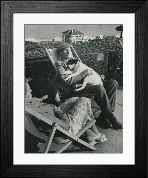 Framed Print : An Elderly couple and their dog taking a nap whilst on a day out to the seaside Framed Print : An Elderly couple and their dog taking a nap whilst on a day out to the seaside