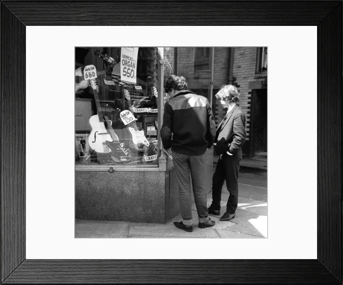 Framed Print : The Beatles May 1964 Young lads looking in the shop window at guitars for sale in Framed Print : The Beatles May 1964 Young lads looking in the shop window at guitars for sale in
