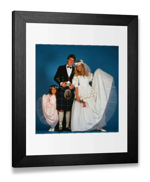 Framed Print : Wedding dress fashion, February 1987 Model wearing wedding dress with groom wearing