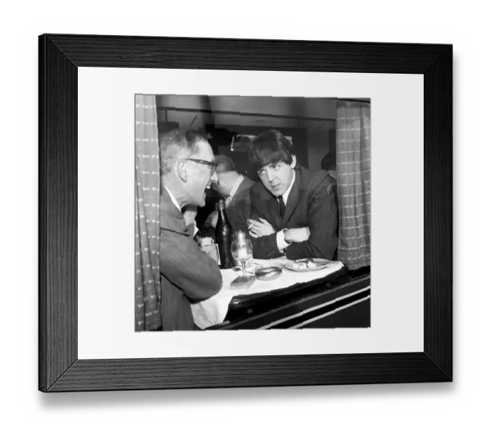 Framed Print : Paul McCartney of The Beatles and actor Wilfred Bramble chat at dining table Framed Print : Paul McCartney of The Beatles and actor Wilfred Bramble chat at dining table