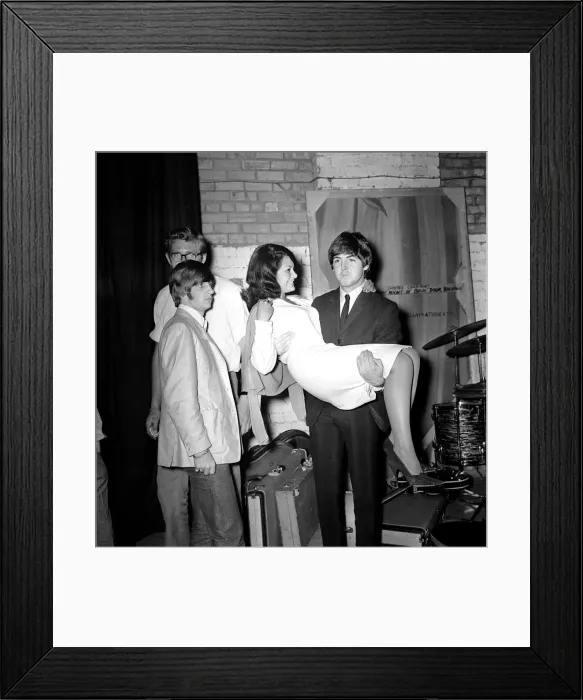 Framed Print : Paul McCartney holding Cherry Rowland as Ringo Starr watches at the Futurist theatre in