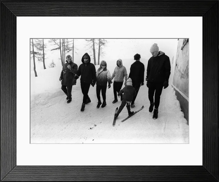 Framed Print : Beatles singer John Lennon on a skiing holiday in St Moritz Switzerland with his wife Framed Print : Beatles singer John Lennon on a skiing holiday in St Moritz Switzerland with his wife