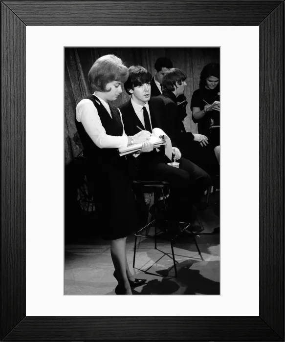 Framed Print : Paul McCartney talking to a reporter in New York during the Beatles first tour of