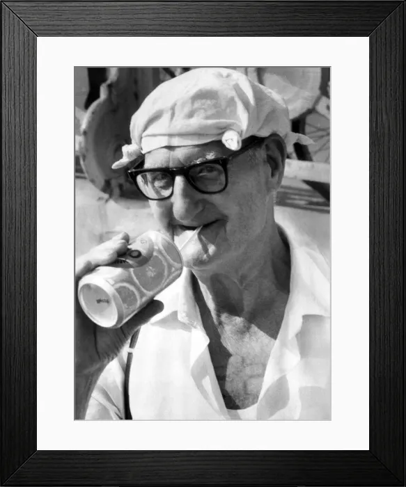 Framed Print : Old man on beach enjoying a drink in the heat. 21st August 1981 Framed Print : Old man on beach enjoying a drink in the heat. 21st August 1981