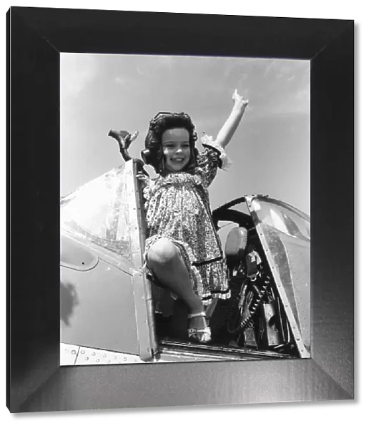 Come Fly With Me. Little Lucy Deplidge seen here waving from the cockpit of a Fleet Air