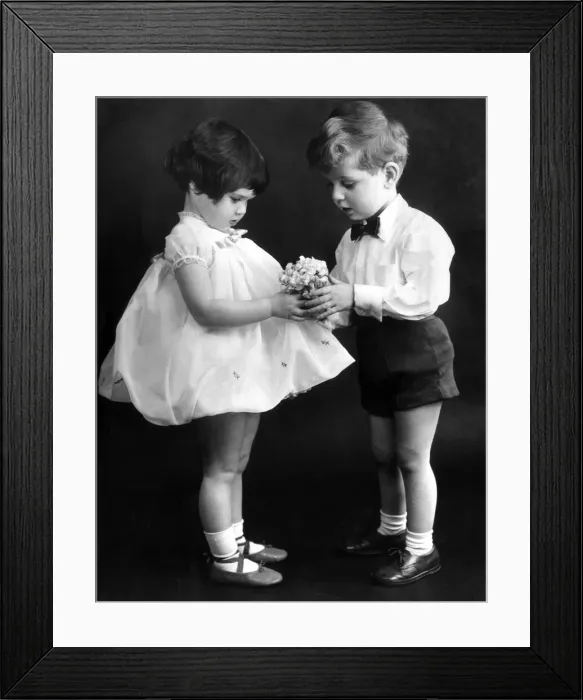 Framed Print : Young couple exchanging flowers. 13th Feb 1959
