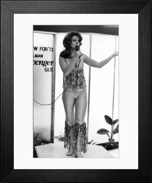 Framed Print : Model performing on the Chrysler Avenger stand at he 1972 Motor Show at Earls Court 19th