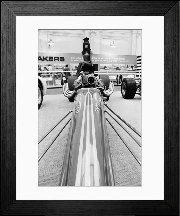 Framed Print : Model drapped over a hot rod dragster car at Motor Show at Horticultural Hall 2nd January