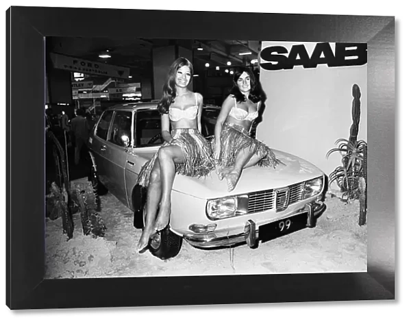 Models drapped over the bonnet of a Saab 99 Motor Car at the 1969 Motor Show 1st June