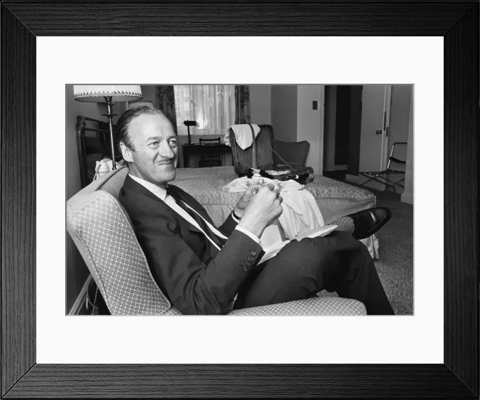 Framed Print : Actor David Niven relaxes in his suite at the Connaught Hotel, London Framed Print : Actor David Niven relaxes in his suite at the Connaught Hotel, London