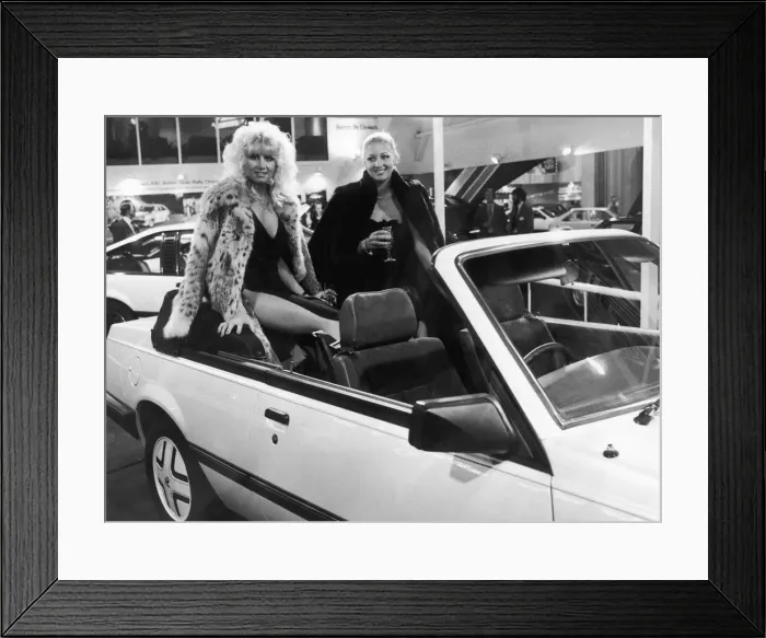 Framed Print : Two models pose in the backseats of the new soft top Cavalier on the Vauxhall General