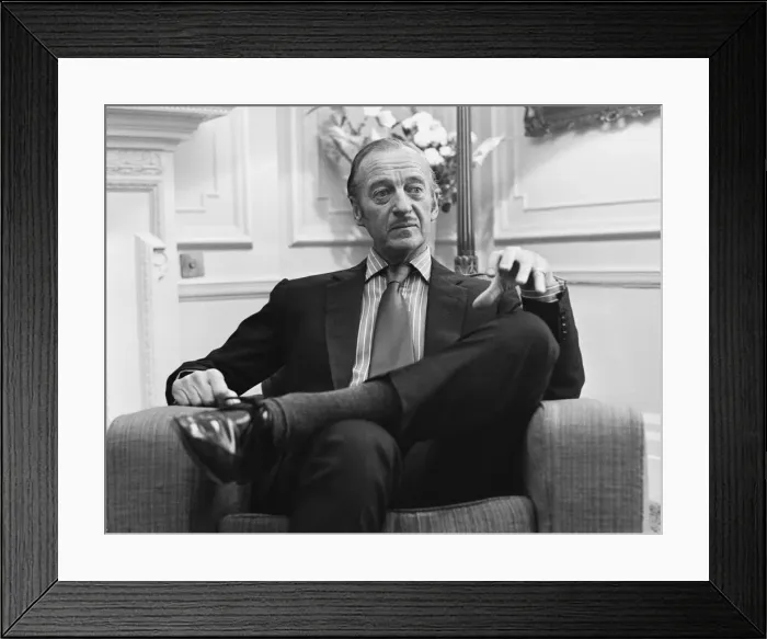 Framed Print : Actor David Niven relaxes in his hotel suite in London. 30th March 1969 Framed Print : Actor David Niven relaxes in his hotel suite in London. 30th March 1969