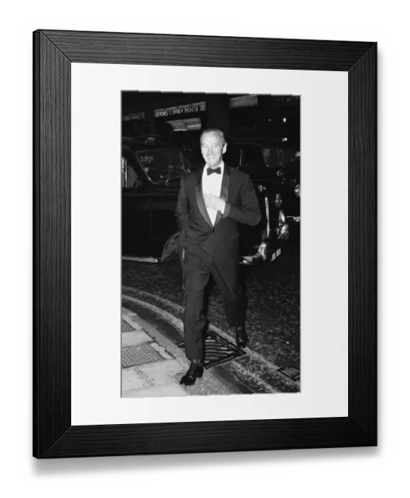 Framed Print : Actor David Niven aarrives at the Prince of Wales Theatre in London for the opening night