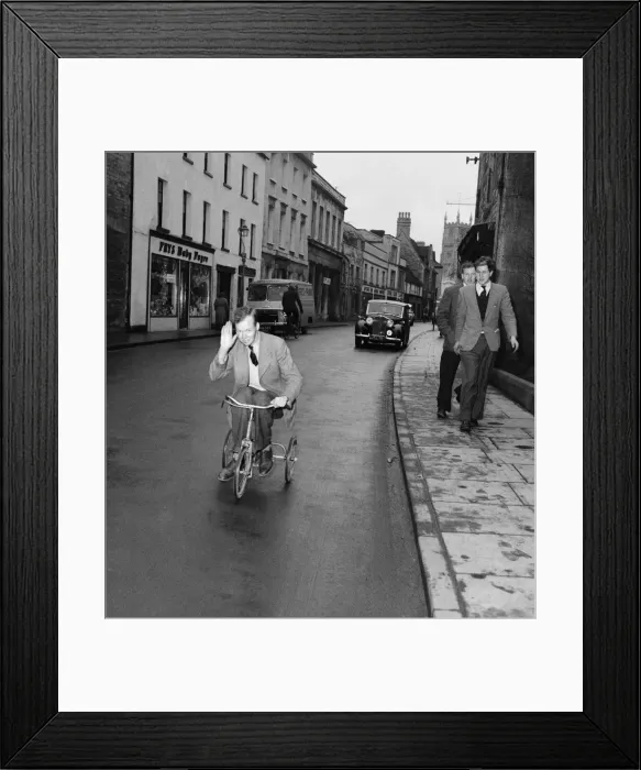 Framed Print : The Earl of Guilford rides through the town of Cirencester on a child Framed Print : The Earl of Guilford rides through the town of Cirencester on a child