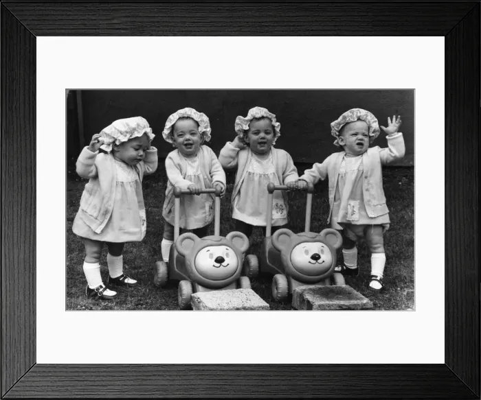 Framed Print : Bouncing quads Claire, Mandy, Nicky and Emma seen here celebrating their first birthday