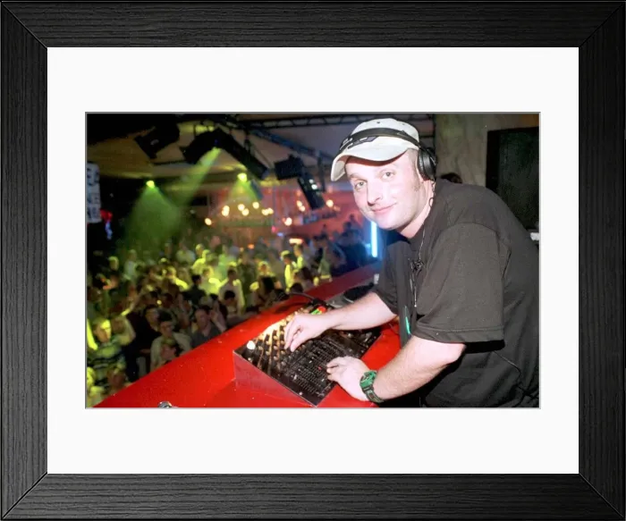 Framed Print : Ibiza Spain July 1999 Disc jockey Dave Pearce in the Eden disco with his
