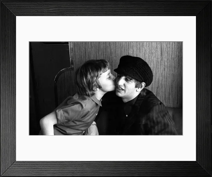 Framed Print : The Beatles February 1964 Beatles drummer Ringo Starr receives a kiss from a young Framed Print : The Beatles February 1964 Beatles drummer Ringo Starr receives a kiss from a young