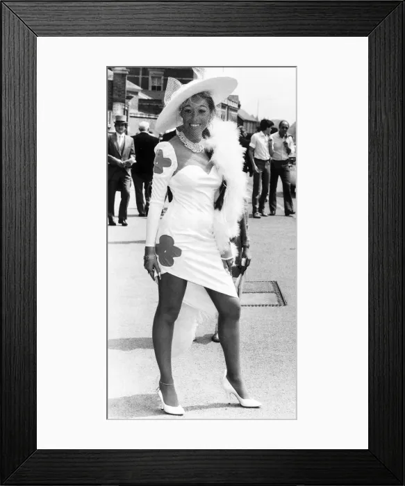 Framed Print : Fashionable racegoer in mini dress at Royal Ascot in June 1985 Framed Print : Fashionable racegoer in mini dress at Royal Ascot in June 1985